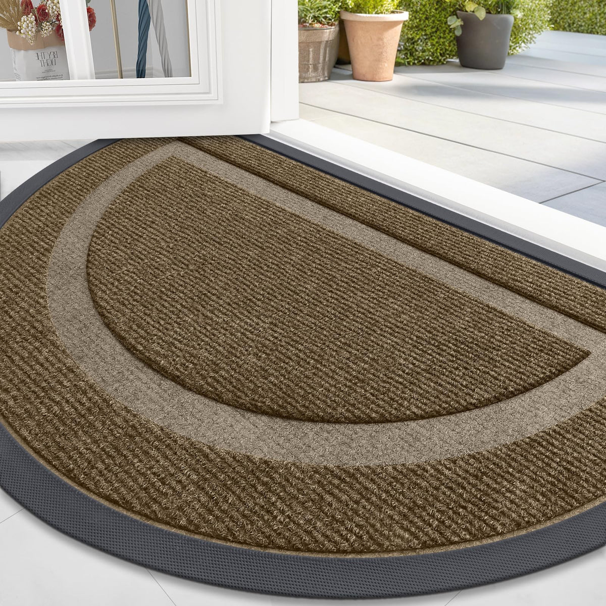 OLANLY half-circle door mat in brown with low profile at entry.