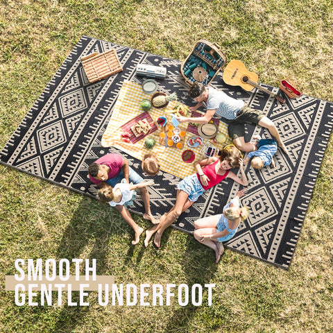 OLANLY outdoor rug on a patio demonstrates UV protection and sturdy construction against daily wear.