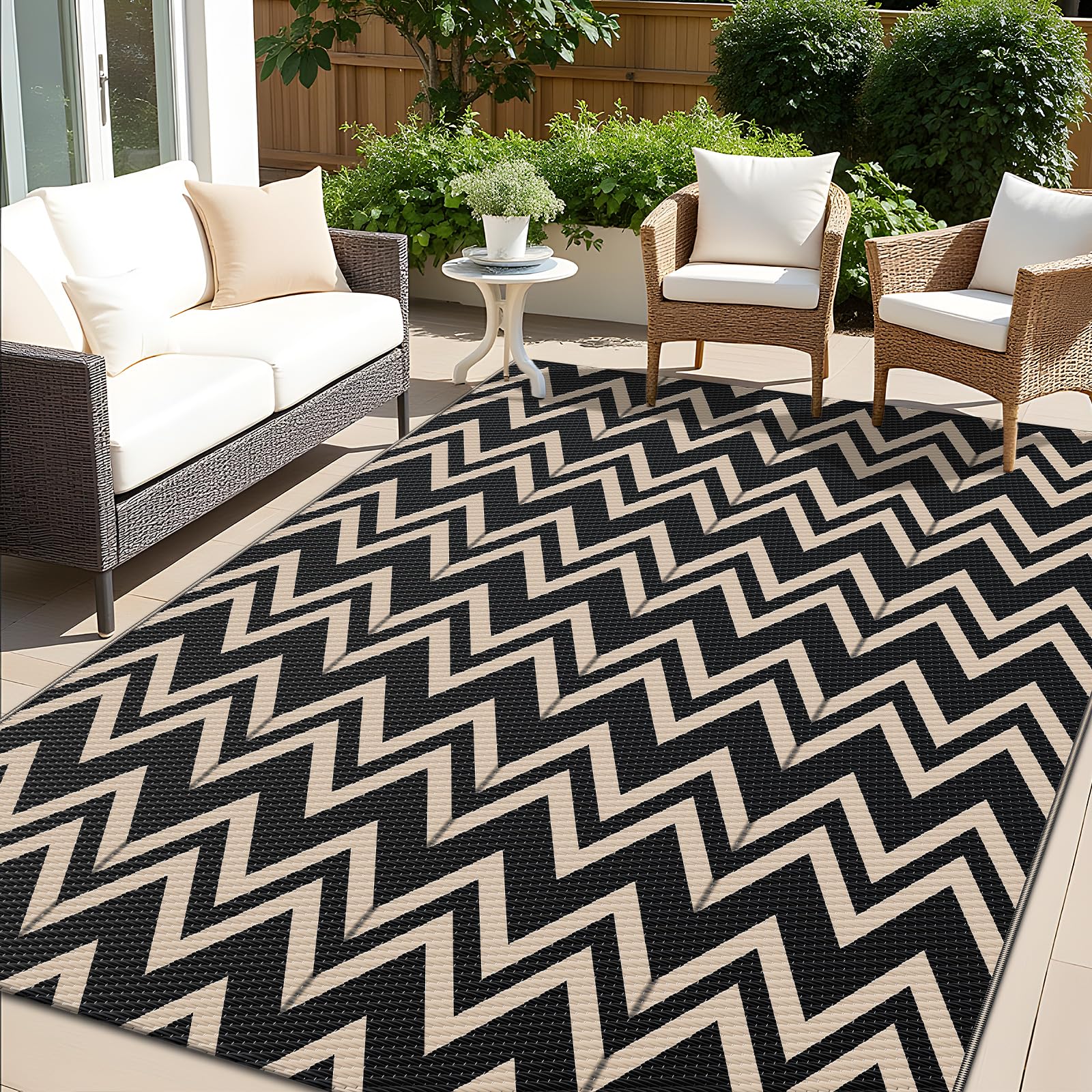 OLANLY waterproof outdoor rug 5x8 ft in black and beige on patio, ideal for decks and balconies.