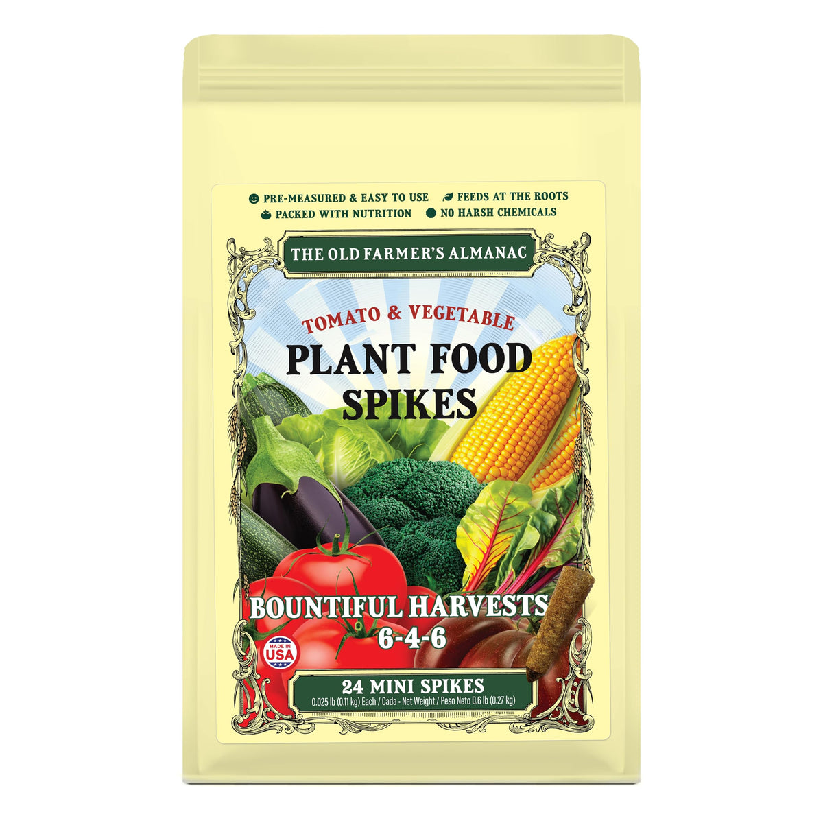 Old Farmer's Almanac tomato and vegetable mini spikes pressed into soil for root-zone nutrition.