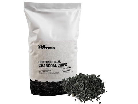 Old Potters charcoal chips packaging close-up highlighting texture and quality.