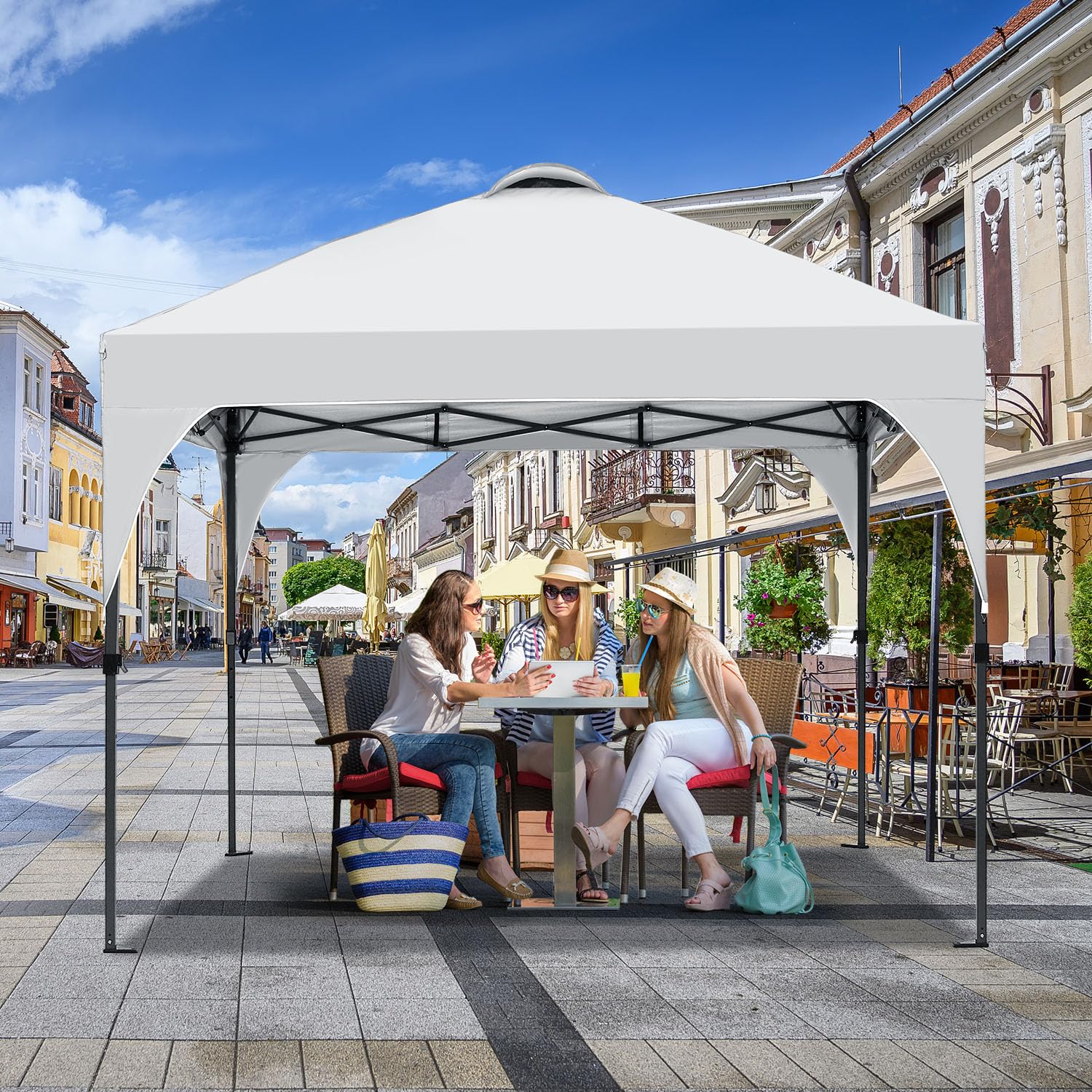 Oneofics pop-up canopy with sandbags and stakes stabilizes in wind.