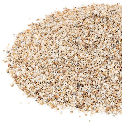 Onlyfire silica sand shown under lava rocks offers stable heat-friendly foundation.