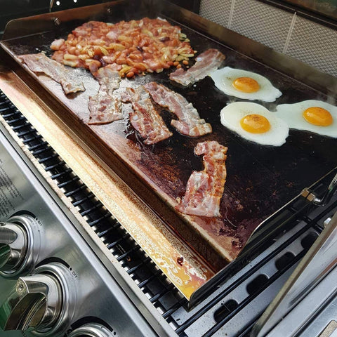OnlyFire griddle raised sidewalls keep food on surface while flipping