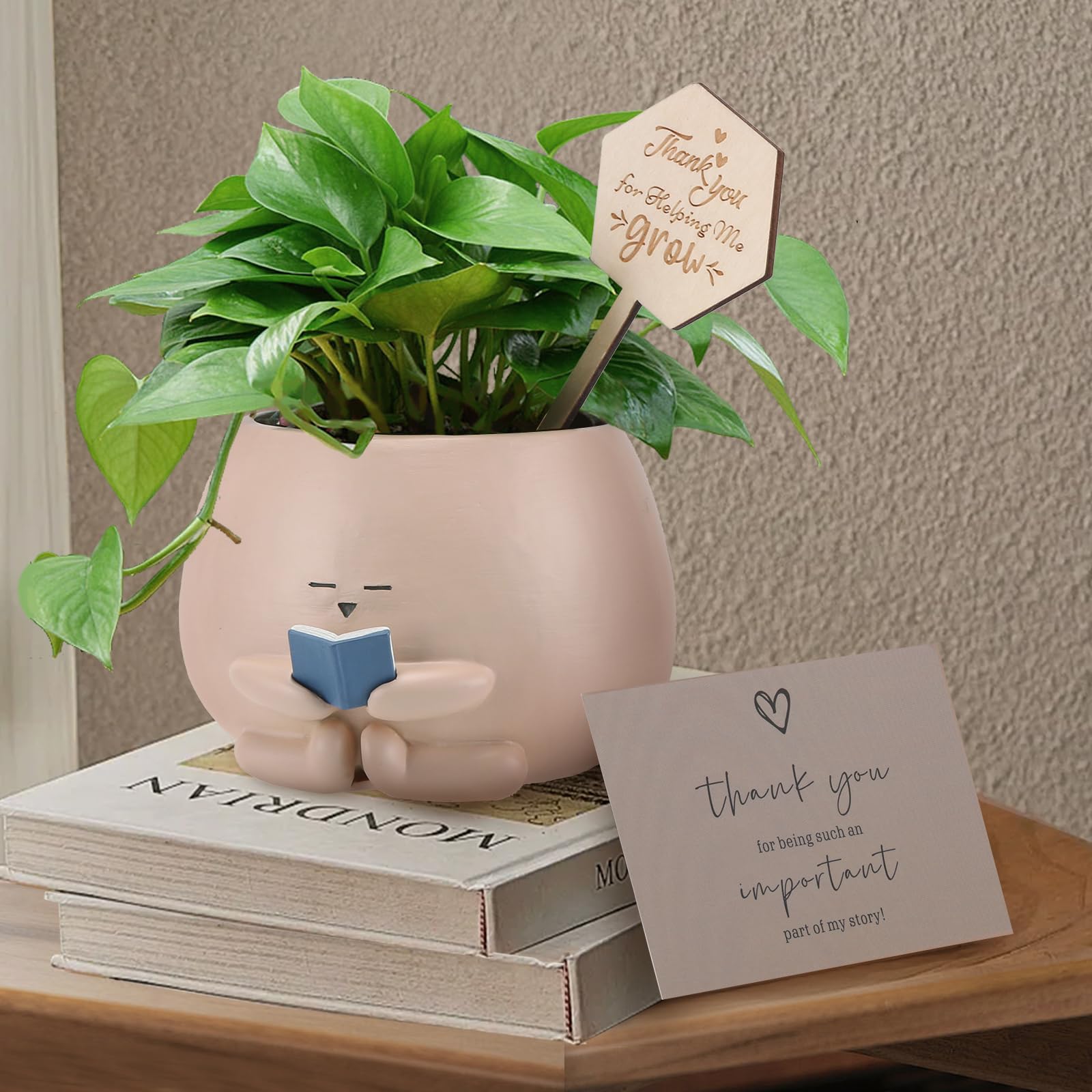 Onzbala Bookworm Planter Pot on a desk adds bright reading nook decor.