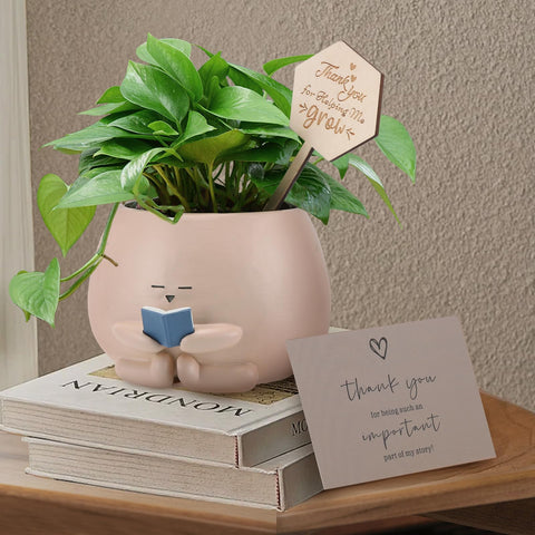 Onzbala Bookworm Planter Pot on a desk adds bright reading nook decor.