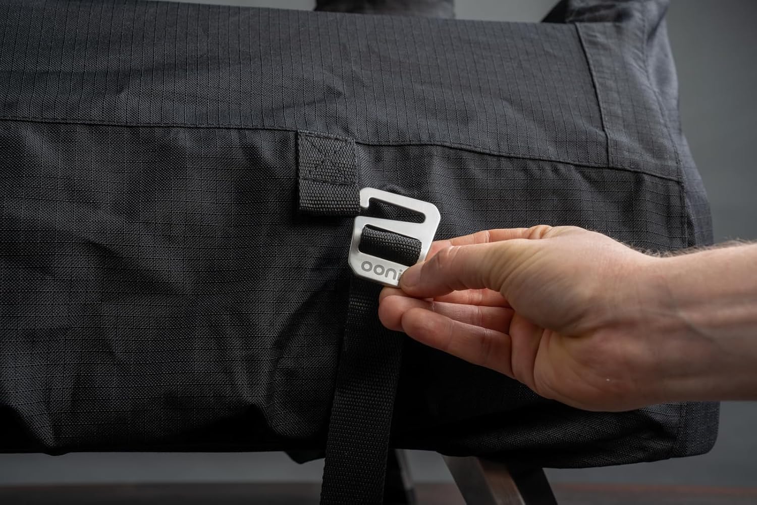 Stitching detail demonstrates durability for outdoor cooking seasons