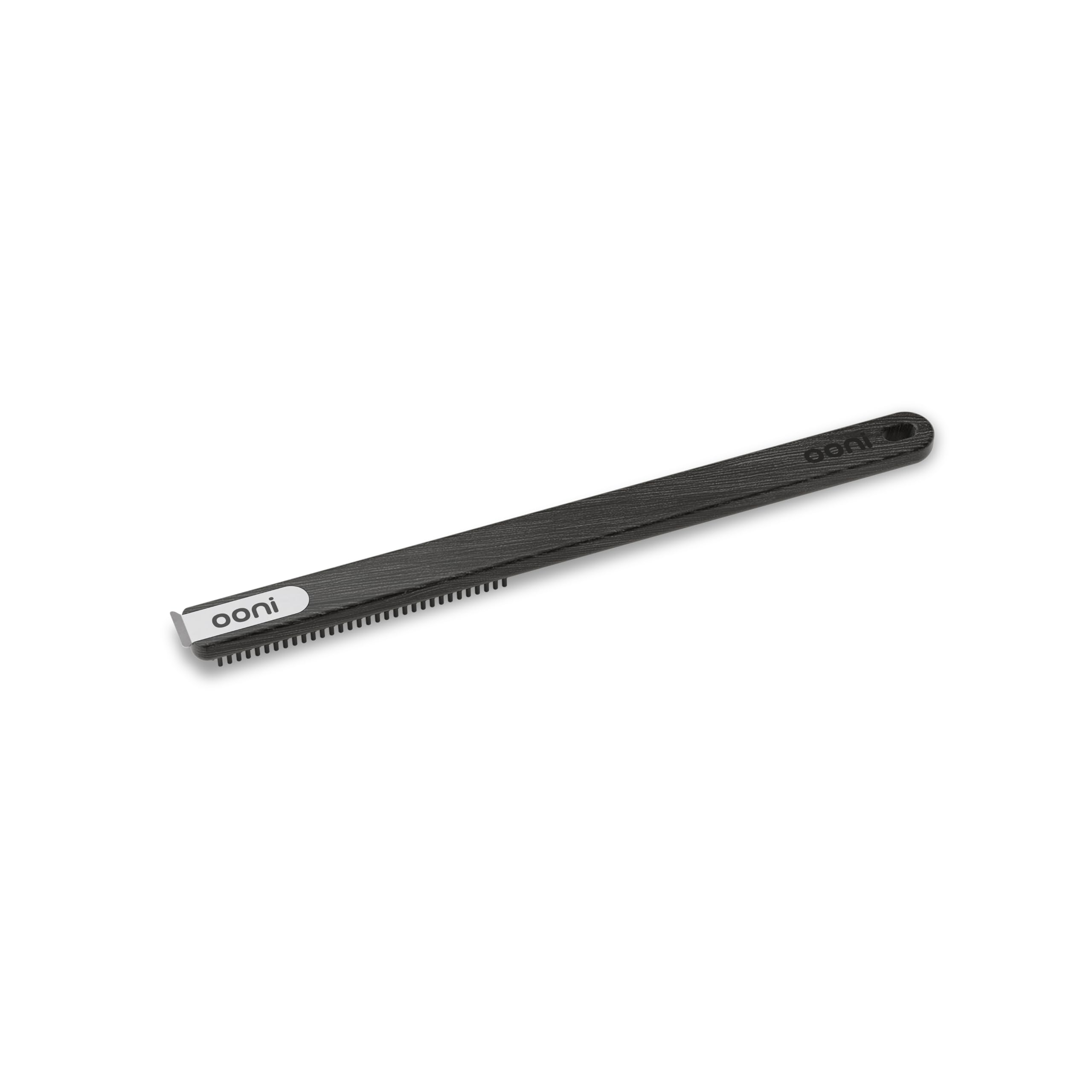 Ooni stainless bristle brush targets pizza stone debris and flour for thorough cleaning.