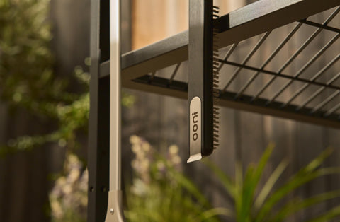 Ooni table hook-compatible design keeps the cleaner within reach on outdoor setup.