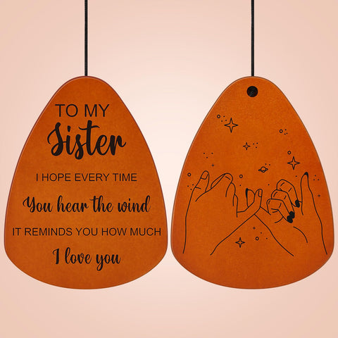 Oprever wind chime engraving with blessings expresses thoughtful sister sentiment.