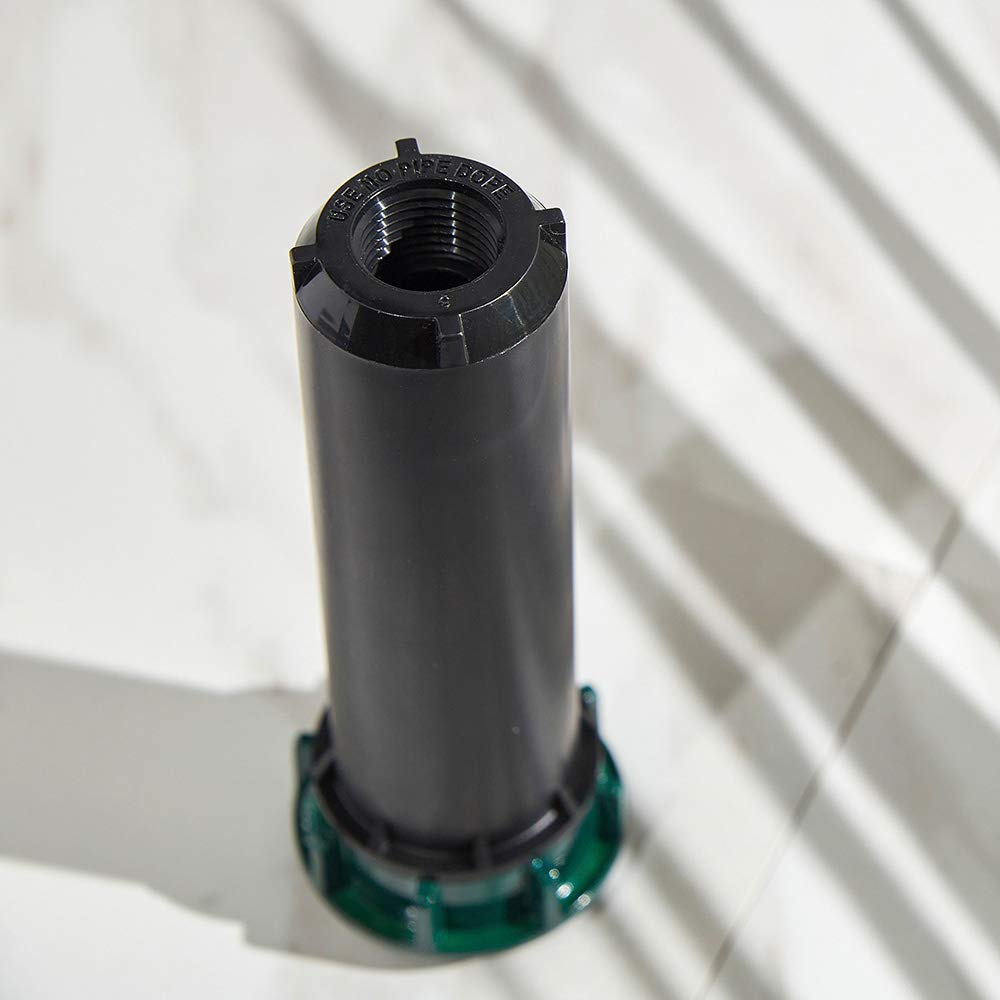 Orbit 54500 durable metal cap protection, shielding the sprinkler from equipment damage.