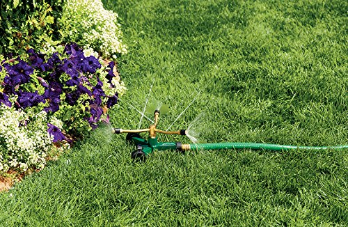 Orbit 58180N three-arm sprinkler in action delivering uniform coverage