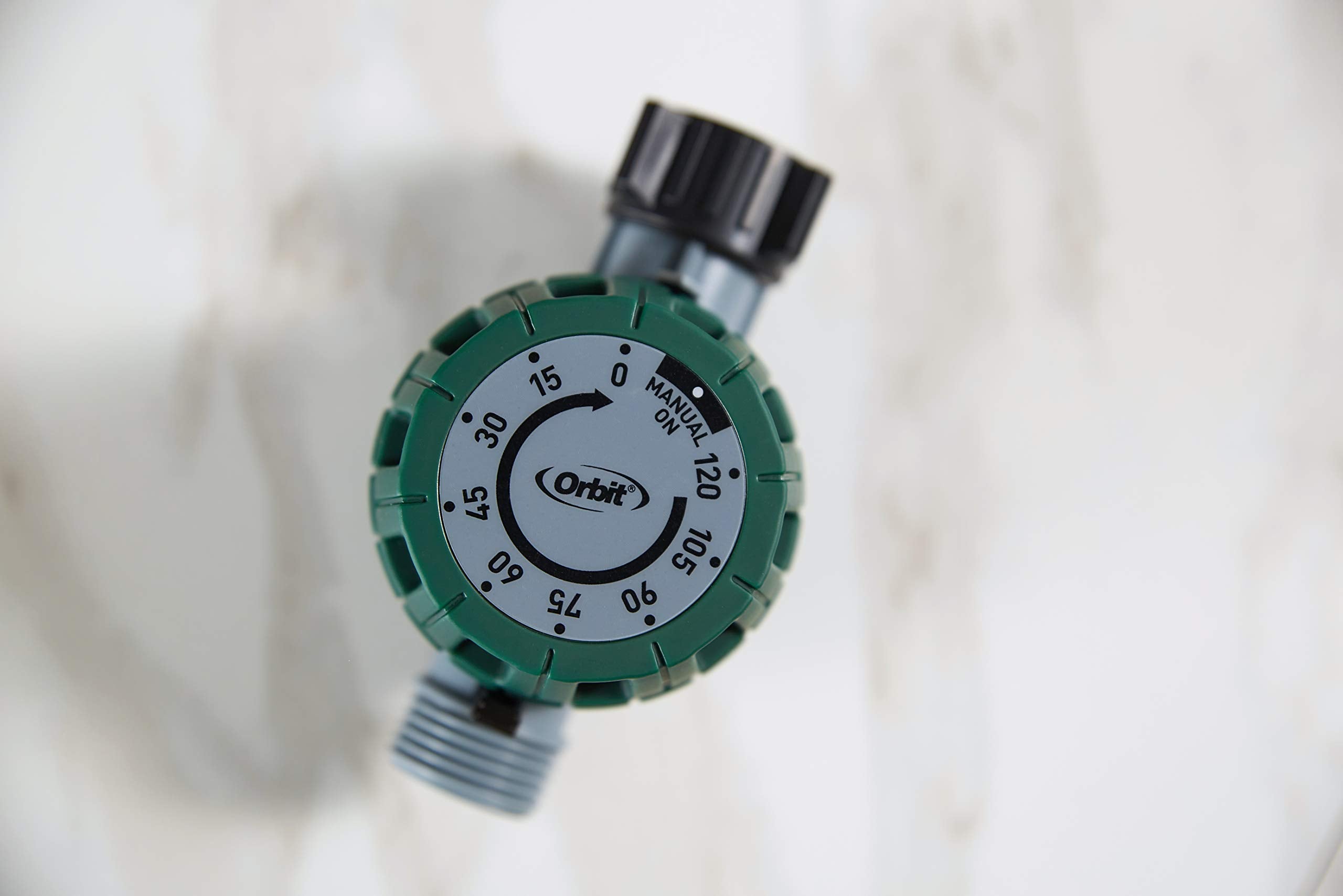 Orbit 62034 timer connected to hose shows practical outdoor use