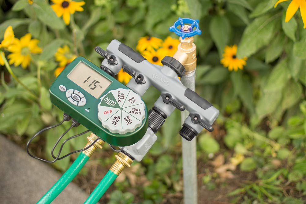 Orbit four-port manifold closeup with simple hose connections for efficient watering.
