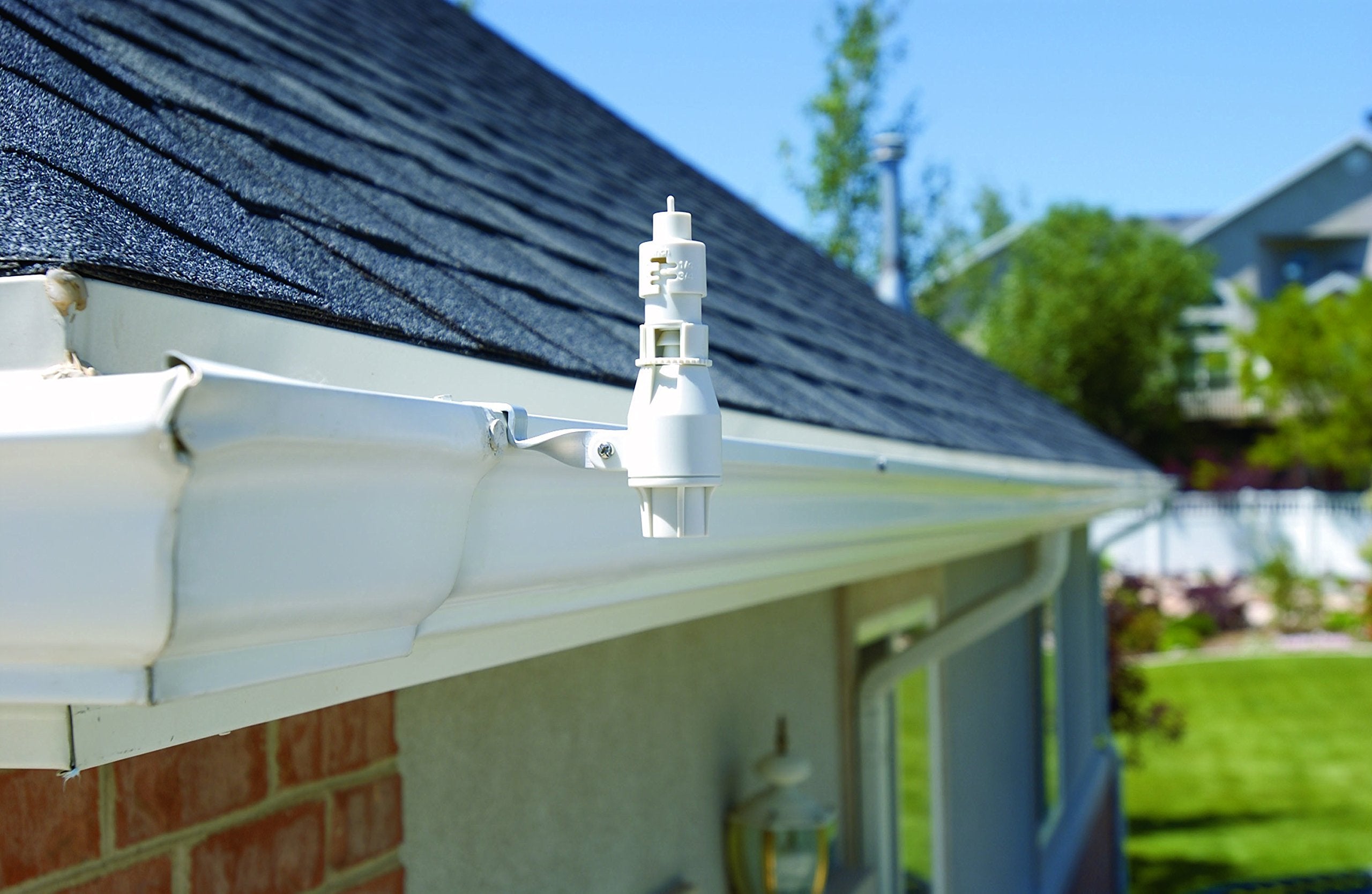 Orbit rain and freeze sensor with wiring to sprinkler controller for automatic control.