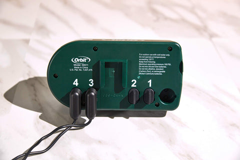 Orbit swivel attachments and battery compartment illustrate tool-free setup.