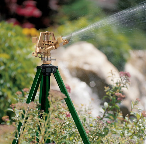 Orbit tripod sprinkler setup showing easy adjustment and secure placement.