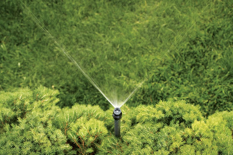 Orbit Watermaster quarter-circle sprinkler head angle close-up showing spray arc.