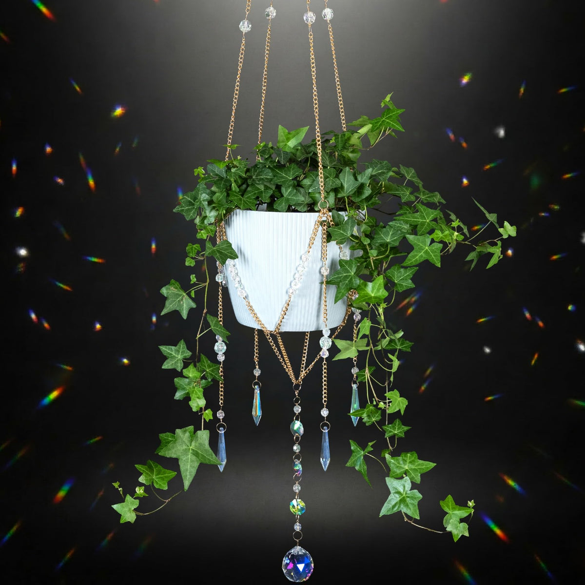 ORCHID AURA beaded plant hanger with sun catcher creates rainbow reflections in sunlight.
