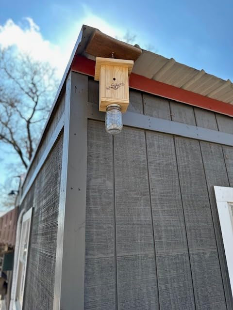 Original B Brothers carpenter bee trap unfinished pine closeup shows natural attraction for placement.