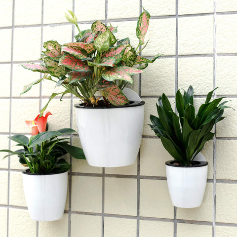 ORIMERC wall-mount vertical garden planters on a wall showcase sleek, durable design for indoor or outdoor use.