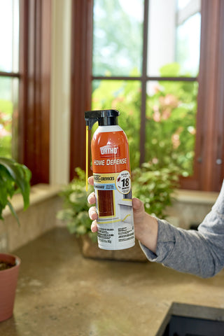Ortho Home Defense foam spray expanding behind appliances for hidden pest targets