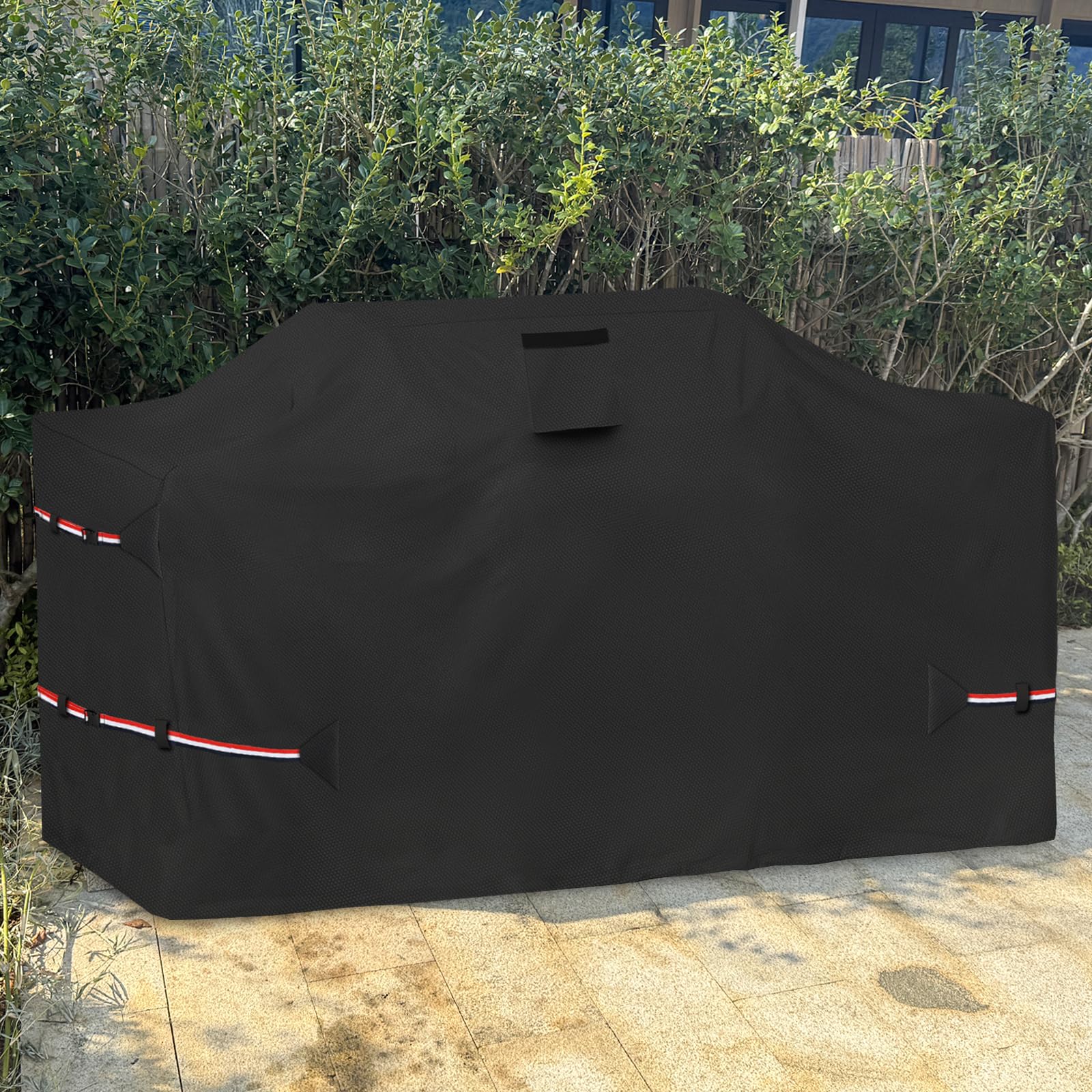 Osileyo black outdoor grill cover on a patio blending with furniture