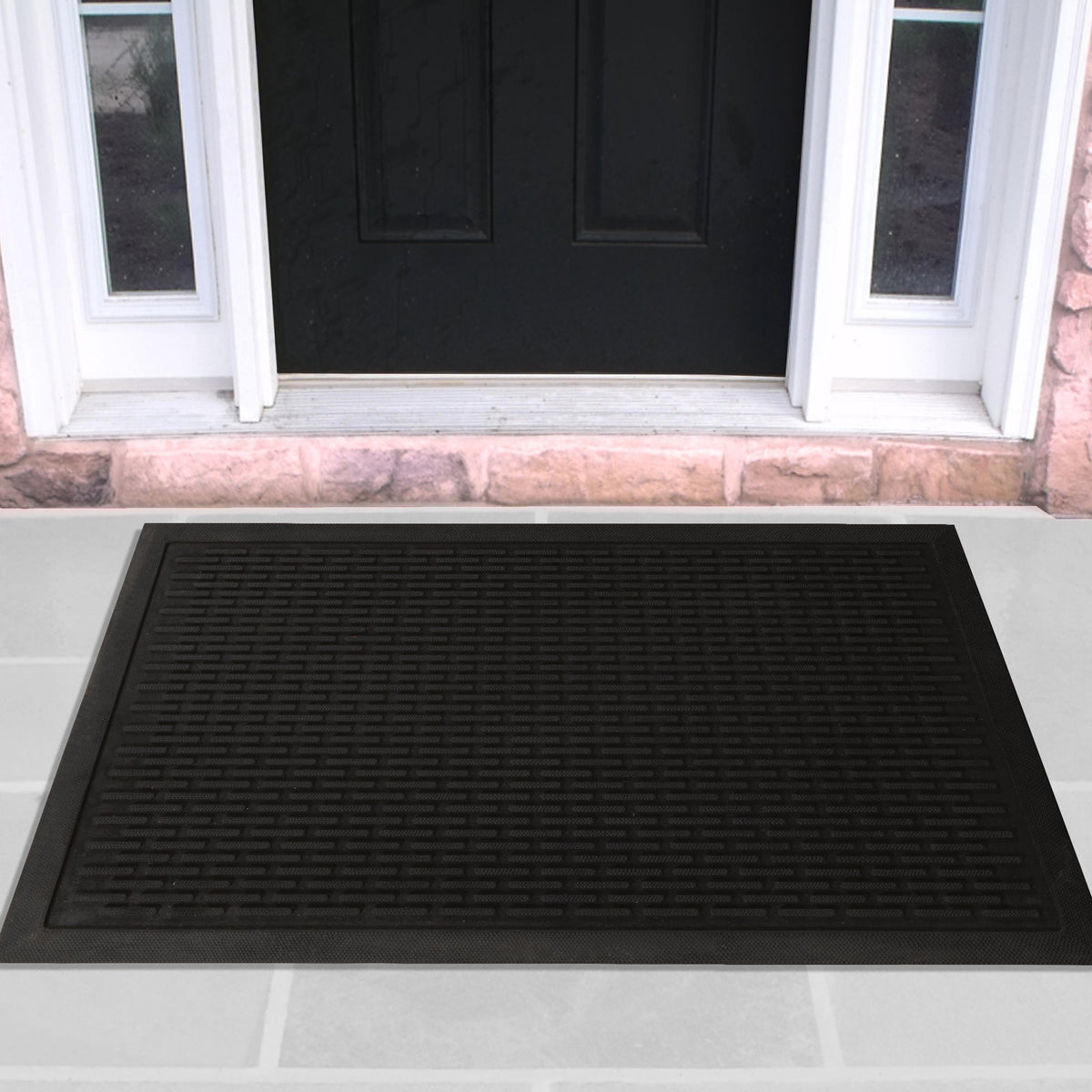Ottomanson rubber ridge doormat at front door scrapes dirt for cleaner entry.