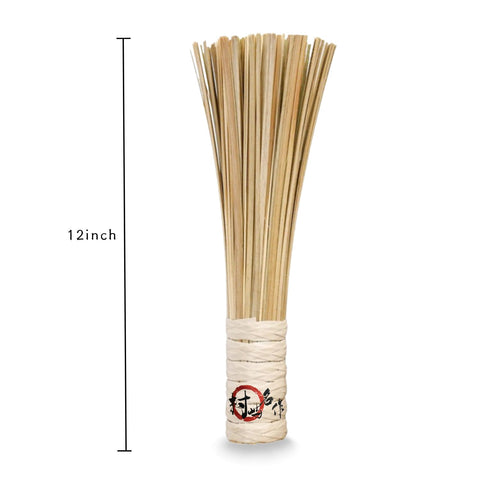 OTYFGHD bamboo brush in action removes stains from wok and pans.