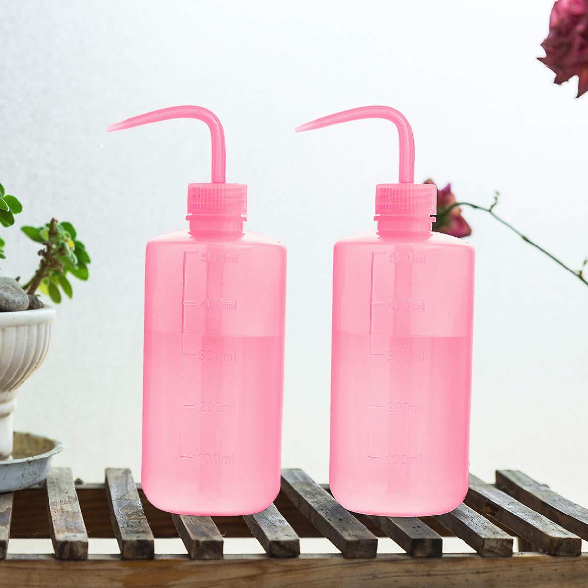 Oubest pink watering bottle with precise nozzle for targeted watering