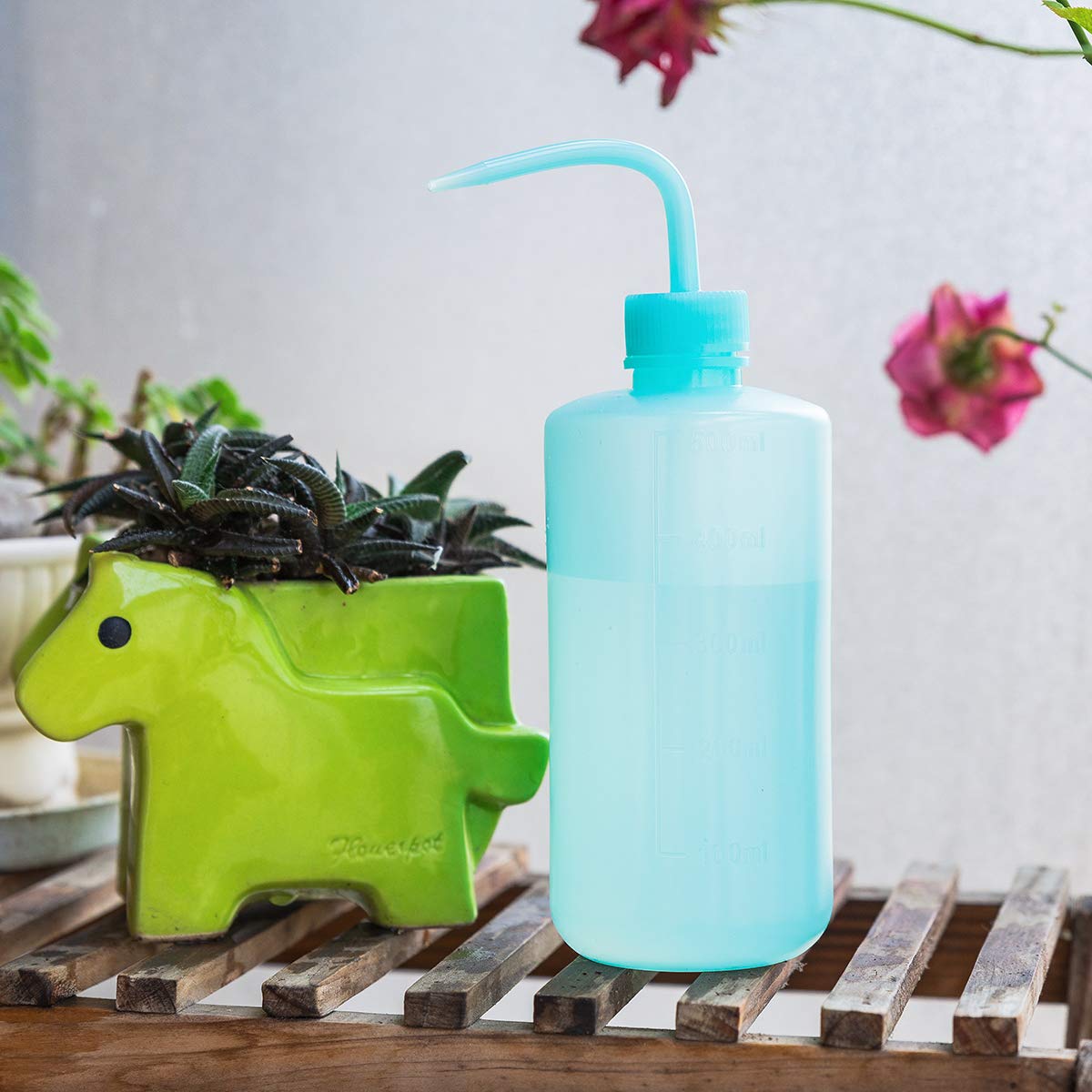 Oubest squeeze bottle blue, right-angle view showing ergonomic grip.