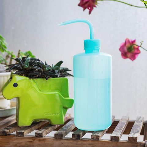 Oubest squeeze bottle blue, right-angle view showing ergonomic grip.