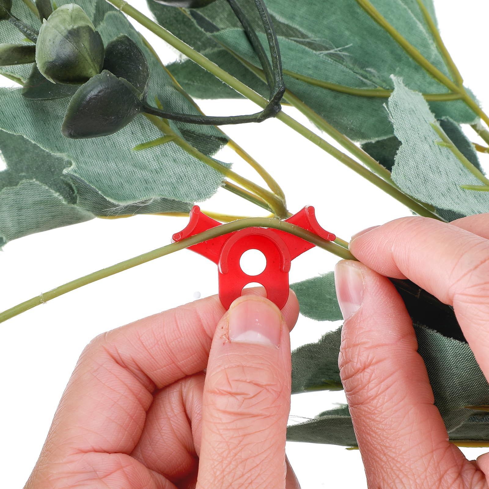Red circle-style clip close-up showing durable anti-slip edge for secure stem guidance.
