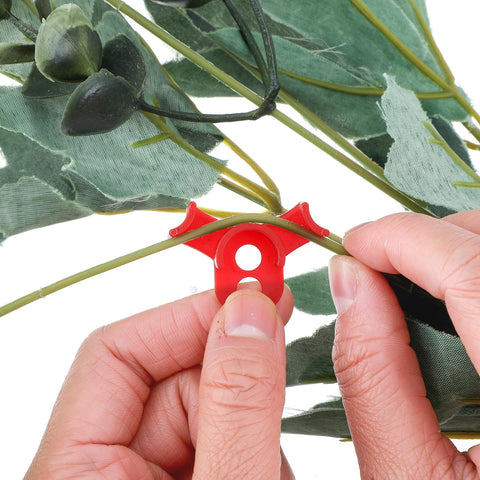 Red circle-style clip close-up showing durable anti-slip edge for secure stem guidance.