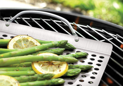 Outset stainless steel grill grid close-up shows perforated surface for even airflow.
