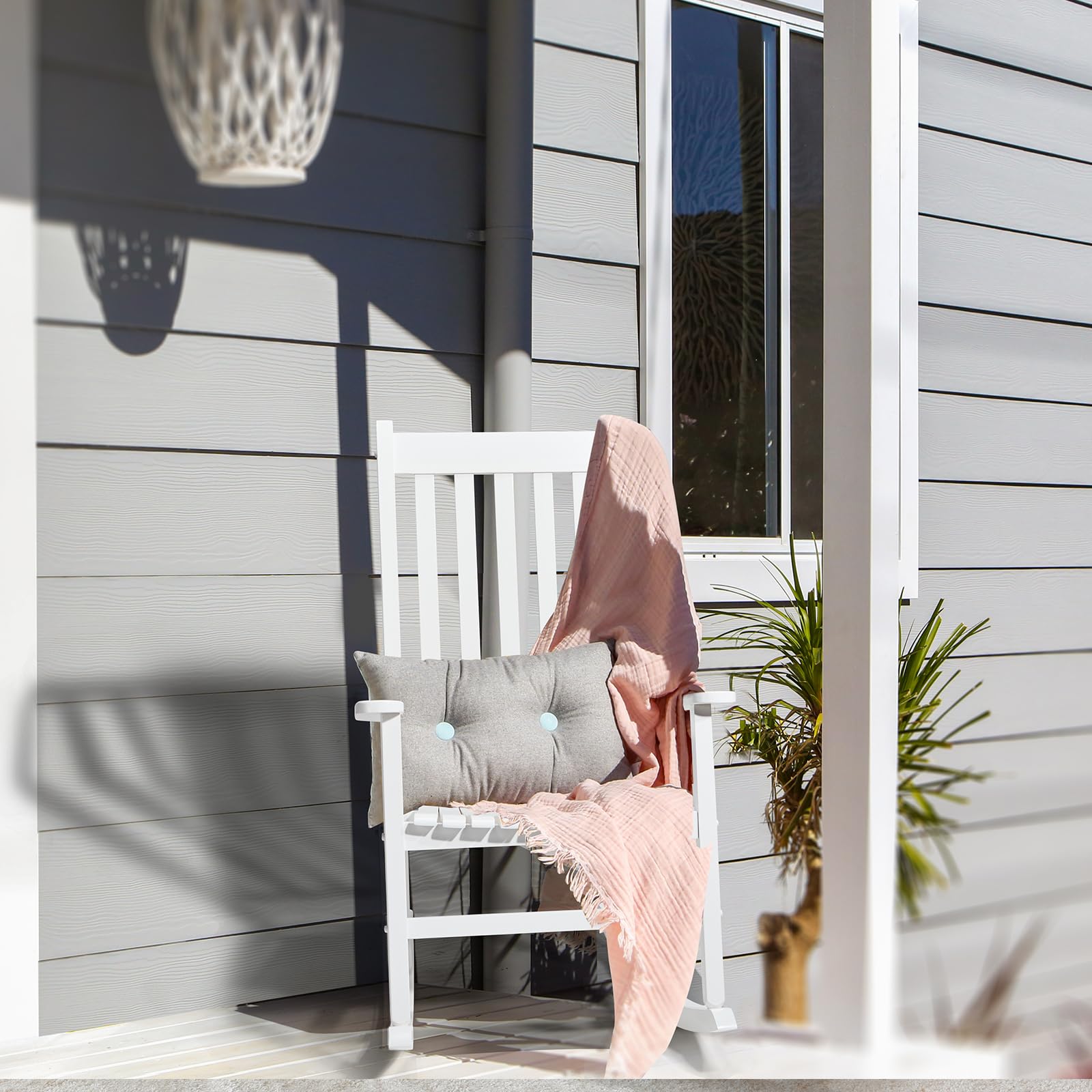 Outvita outdoor rocking chair seat detail highlights ergonomic slats and spacious armrests for comfort.