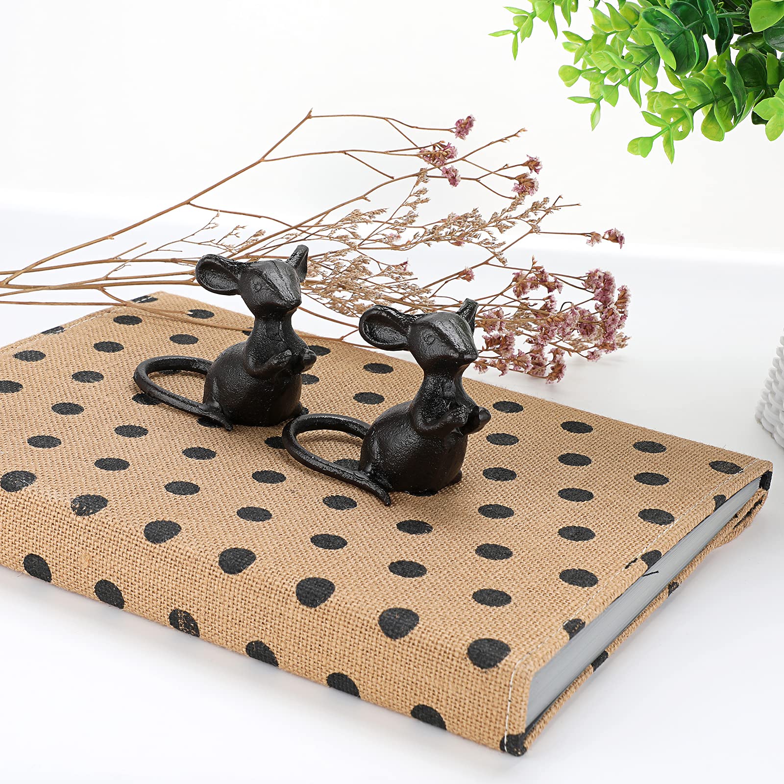 OwnMy black mouse sculpture enhances garden decor with durable, weather-resistant appeal.