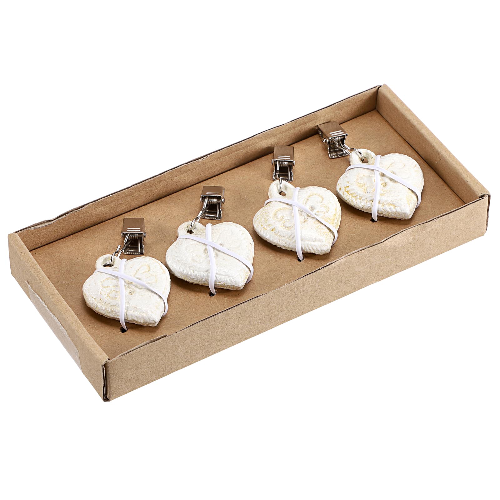 OwnMy heart-design tablecloth weights add vintage charm with practical function.