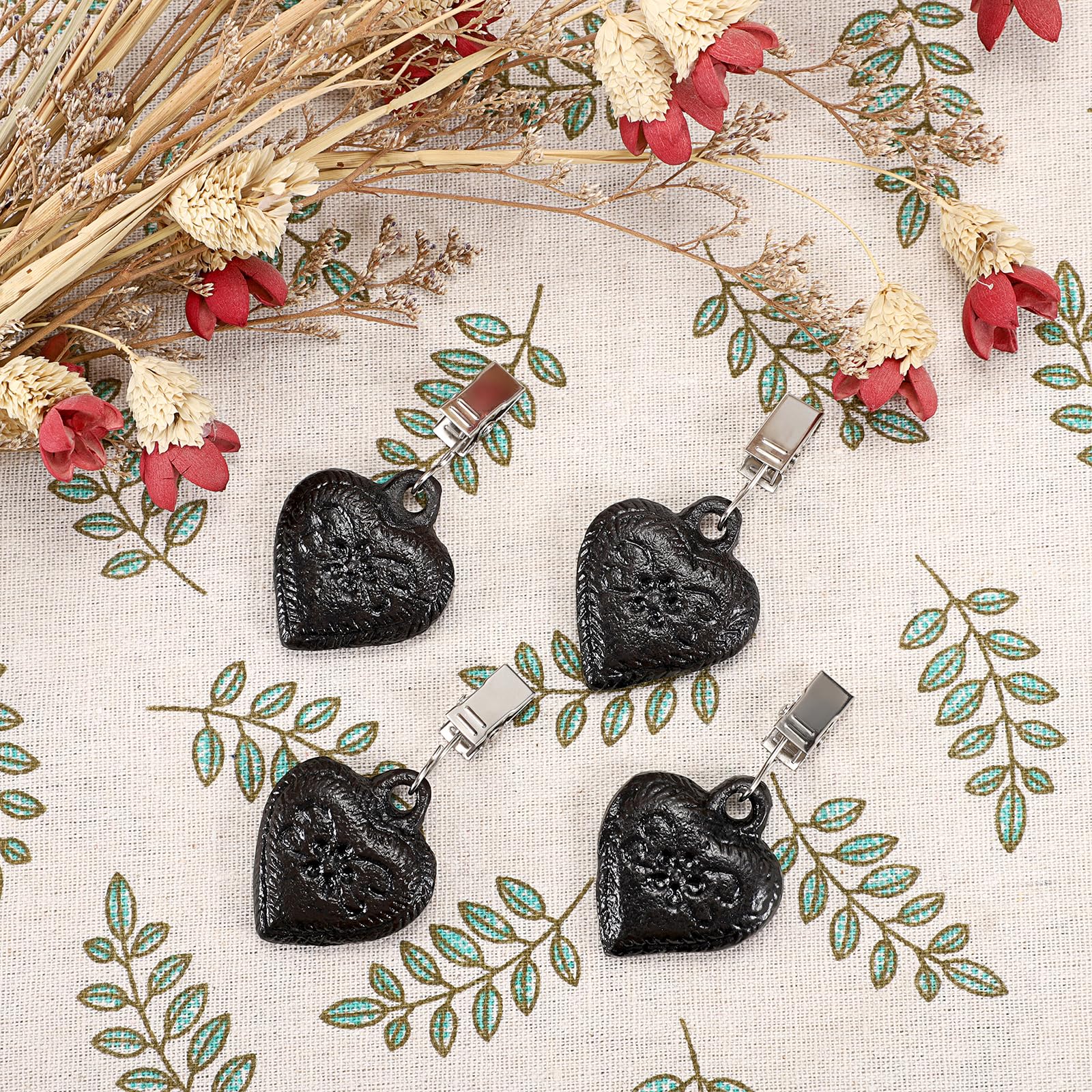 OwnMy heart-pendant tablecloth weight emphasizes vintage styling and fabric stability.