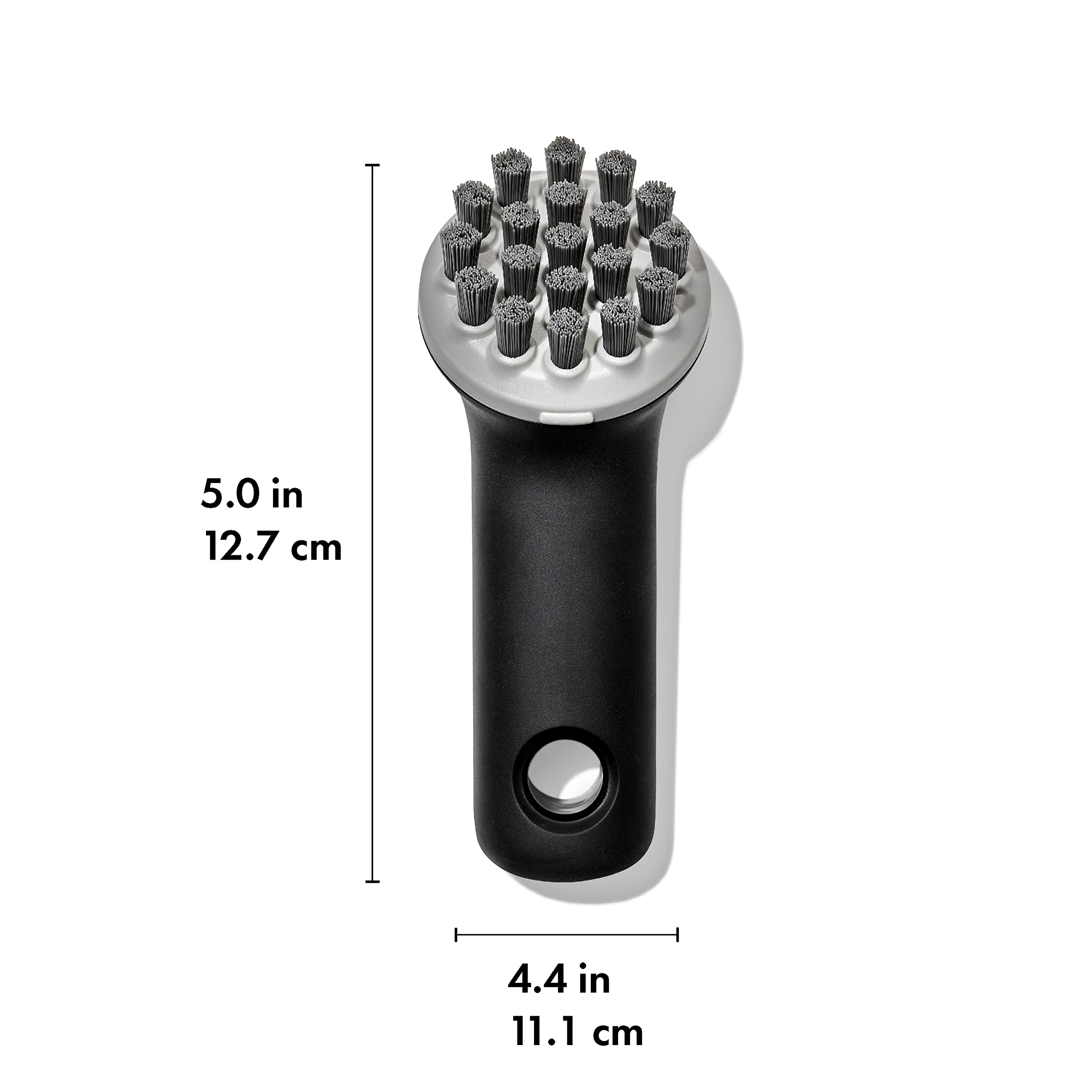 OXO Good Grips Cast Iron Brush bristle pattern cleans flat and ridged cookware effectively.