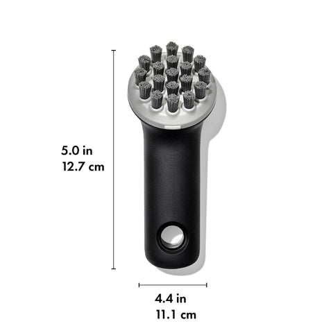 OXO Good Grips Cast Iron Brush bristle pattern cleans flat and ridged cookware effectively.