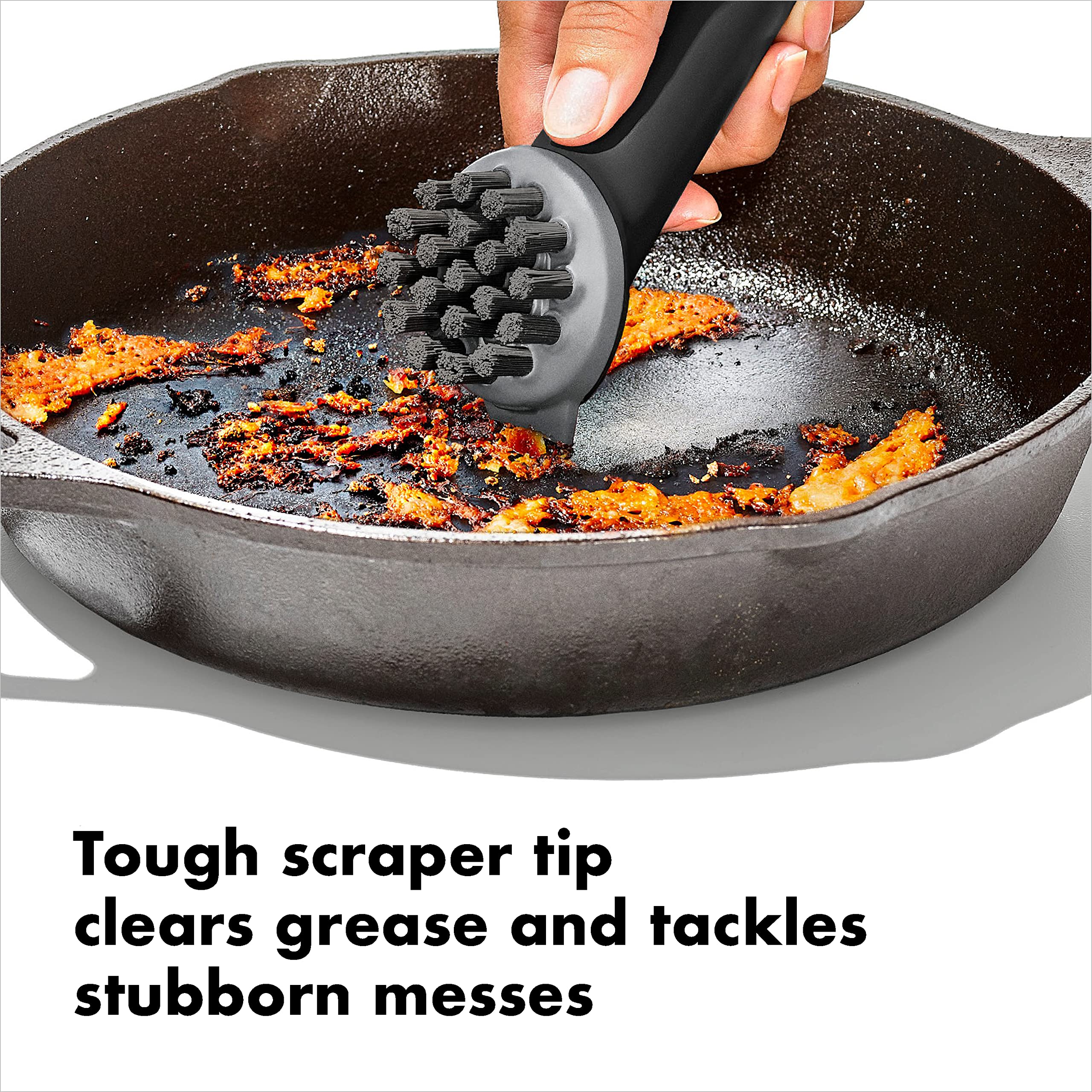 OXO Good Grips Cast Iron Brush handle closeup shows non-slip grip.