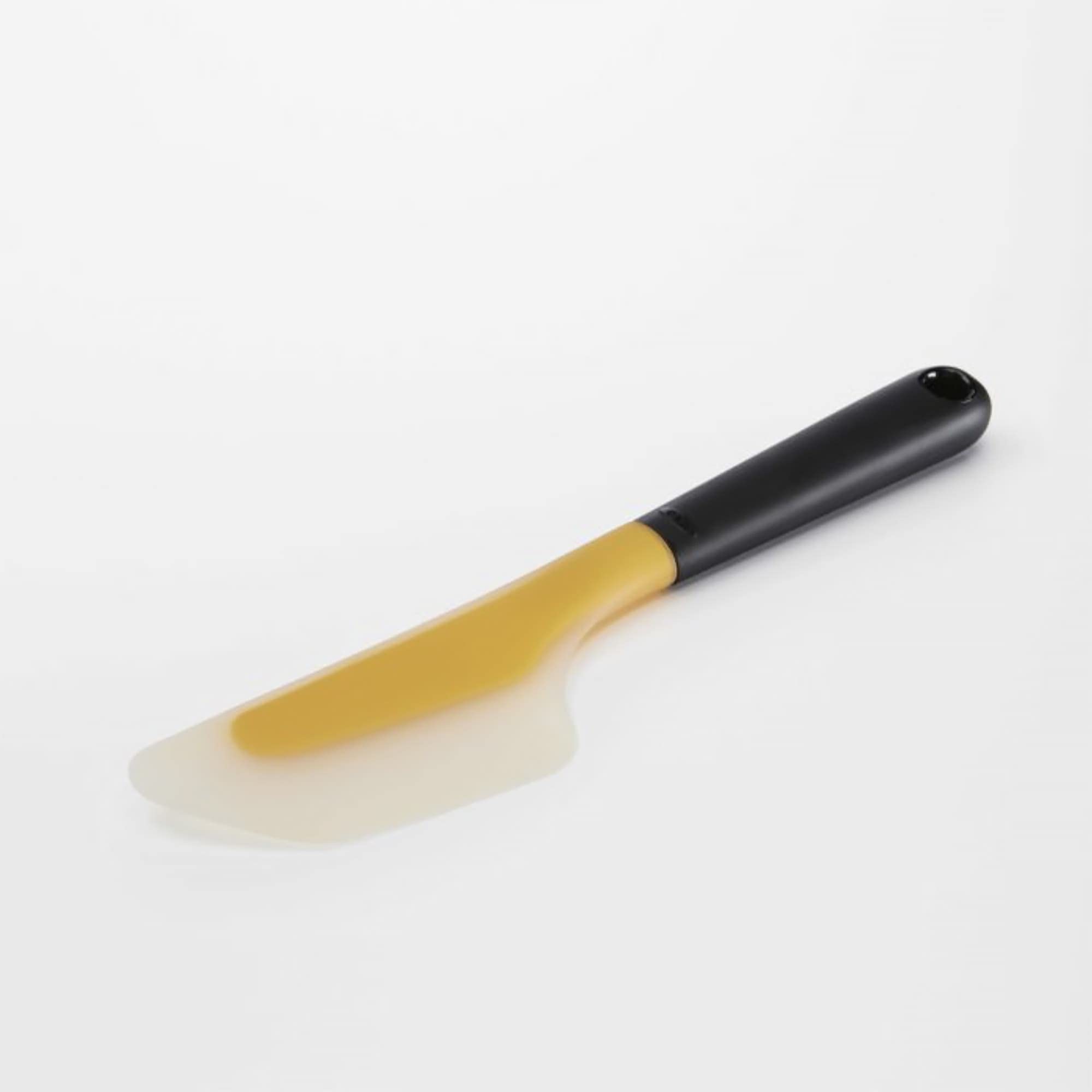 OXO Good Grips flexible head conforms to rounded pans for smooth flipping.