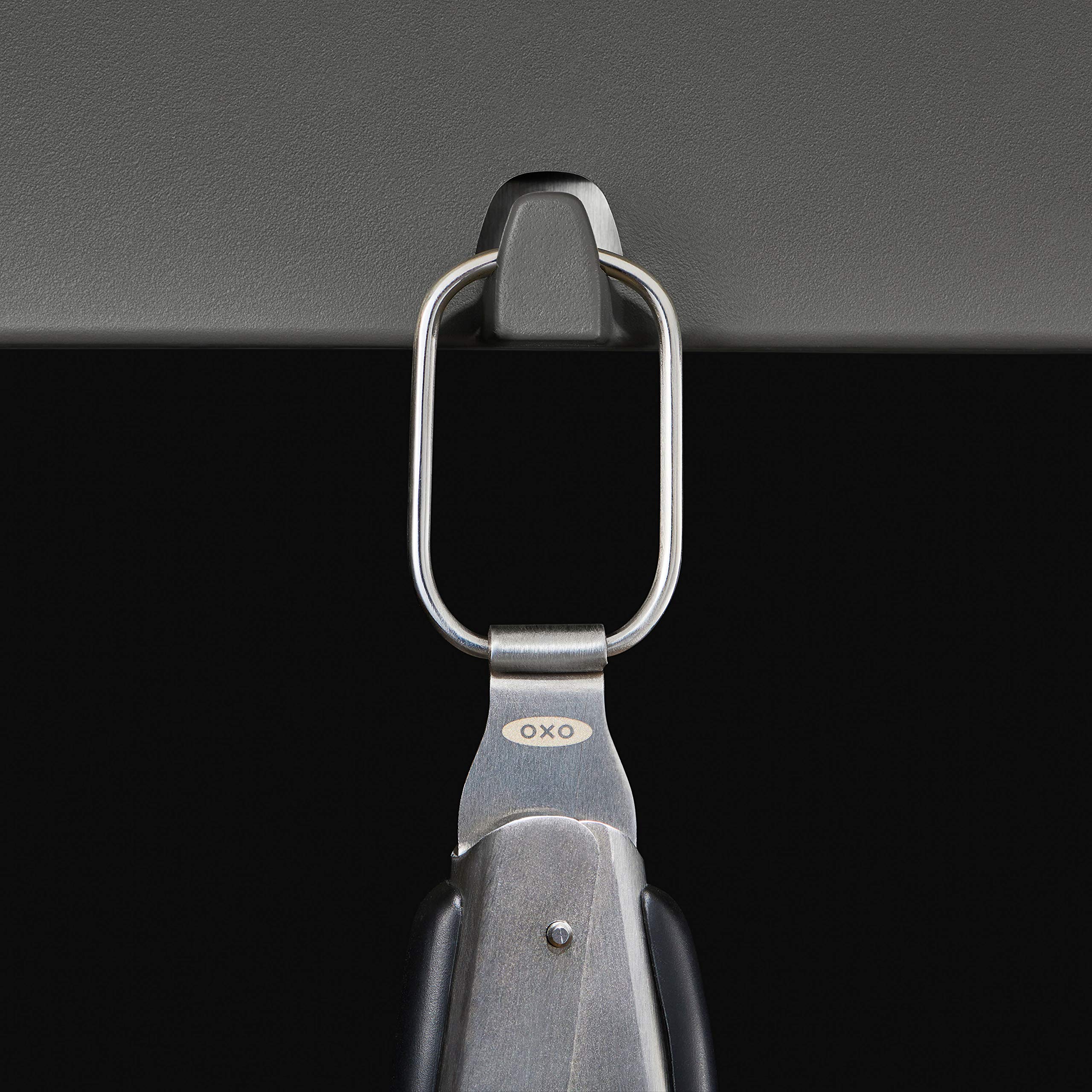 OXO Good Grips Grilling Tongs built-in opener in action