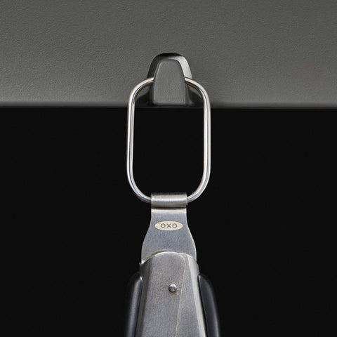 OXO Good Grips Grilling Tongs built-in opener in action