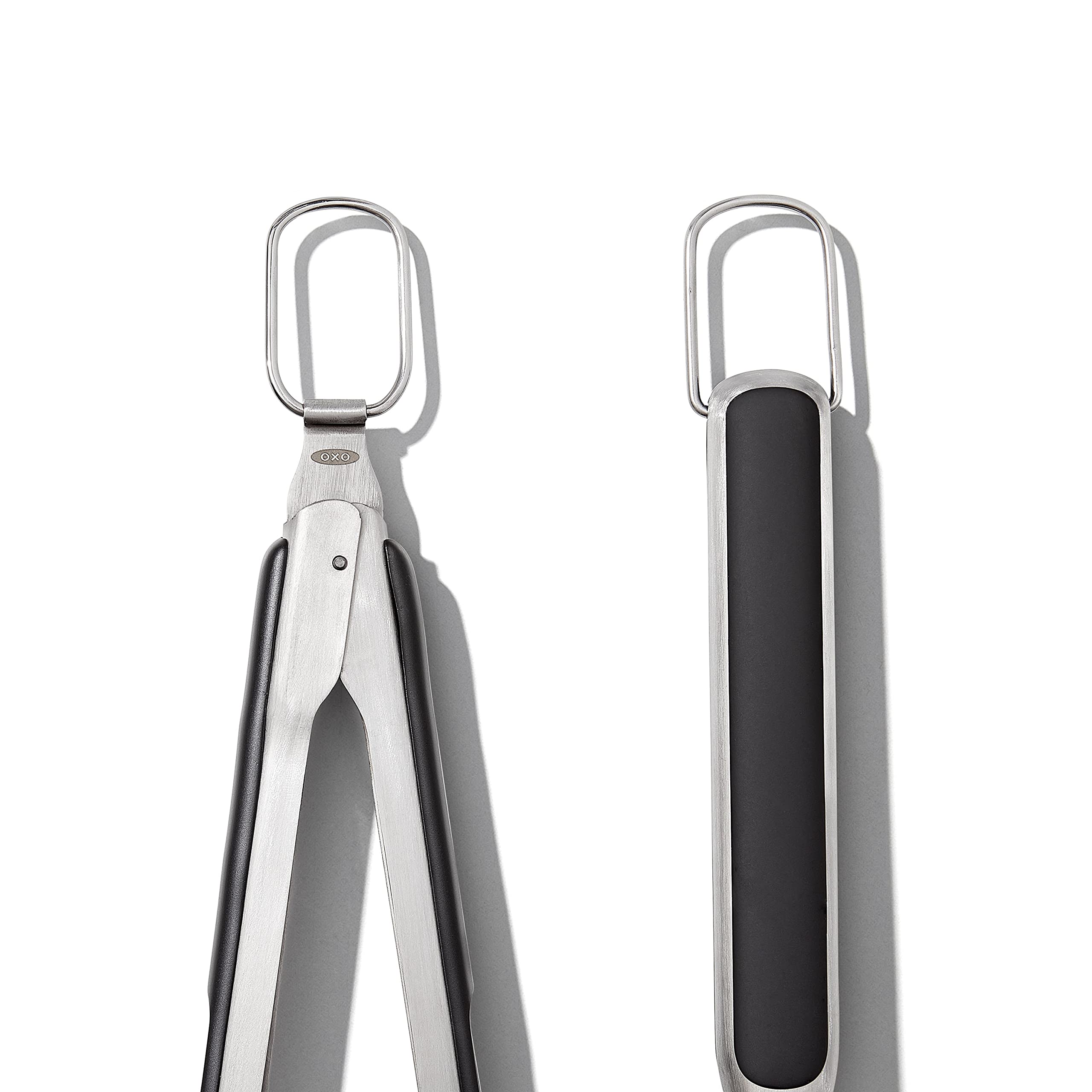 OXO Good Grips tool rest with integrated tong holder for one-handed use.