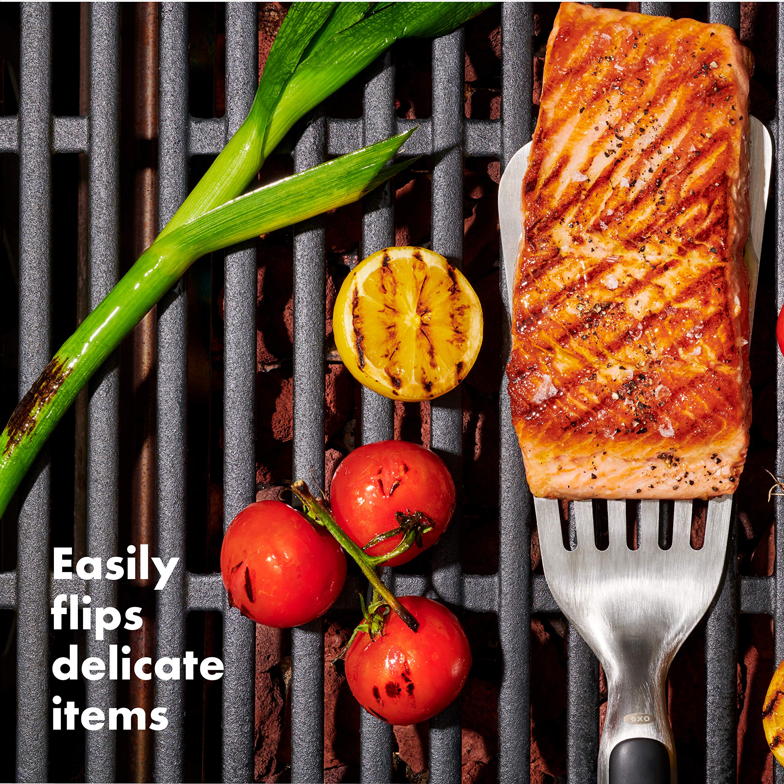 OXO Good Grips precision Turner on grill flipping burgers with control