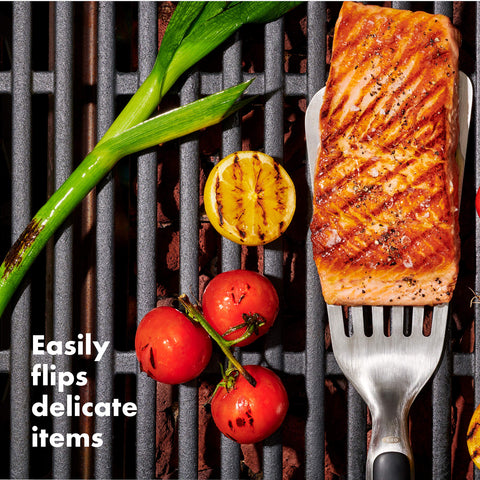 OXO Good Grips precision Turner on grill flipping burgers with control