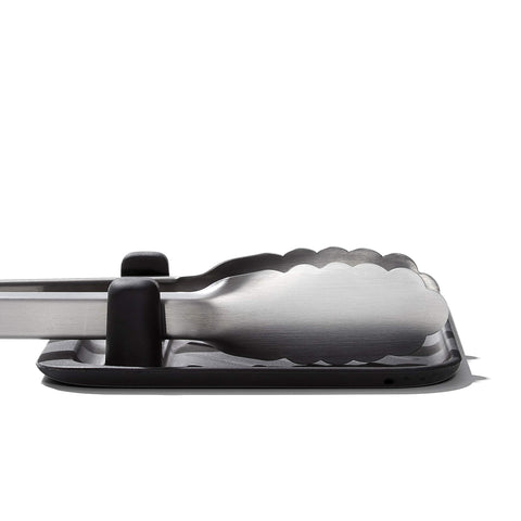 Protects countertops while keeping tools within reach.