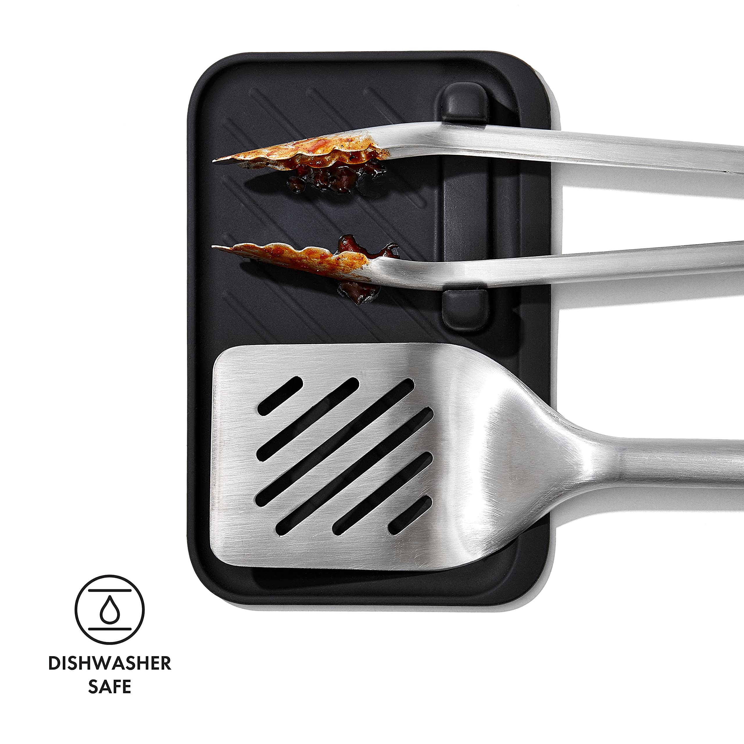 Close-up of OXO Good Grips turner enabling confident burger flips.